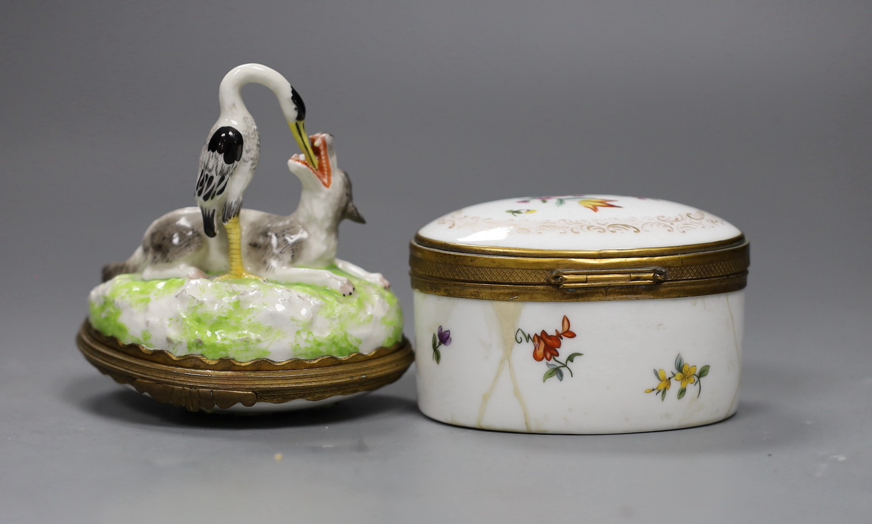 Two Continental porcelain snuff boxes circa 1900, one a novelty Aesop fable design, height 9cms